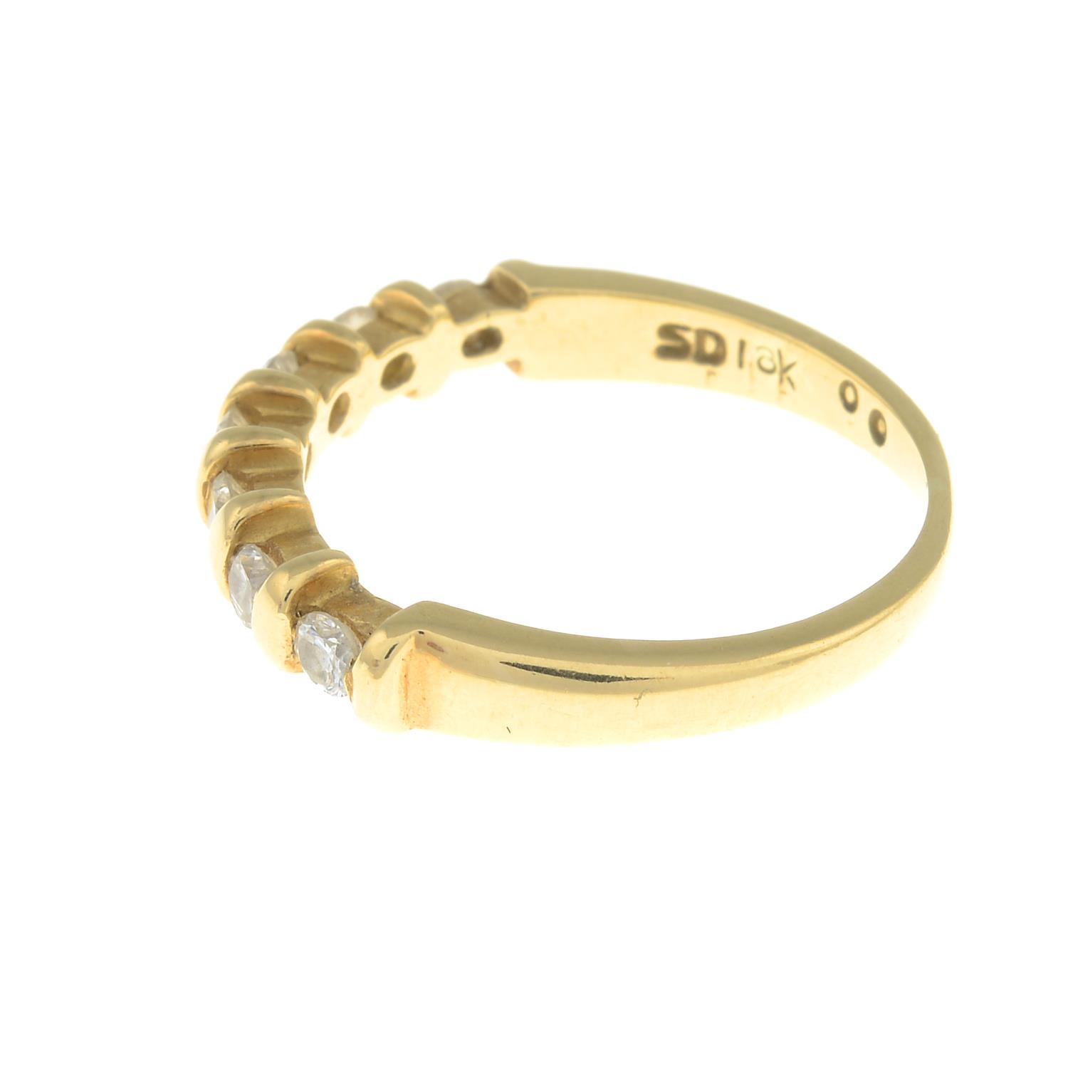 An 18ct gold diamond seven-stone ring.Total diamond weight 0.40ct, stamped to band. - Image 3 of 3