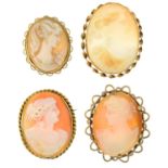 Four shell cameo brooches and a 22ct gold band ring.