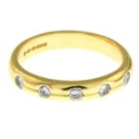 An 18ct gold brilliant-cut diamond five-stone band ring.Estimated total diamond weight 0.25ct.