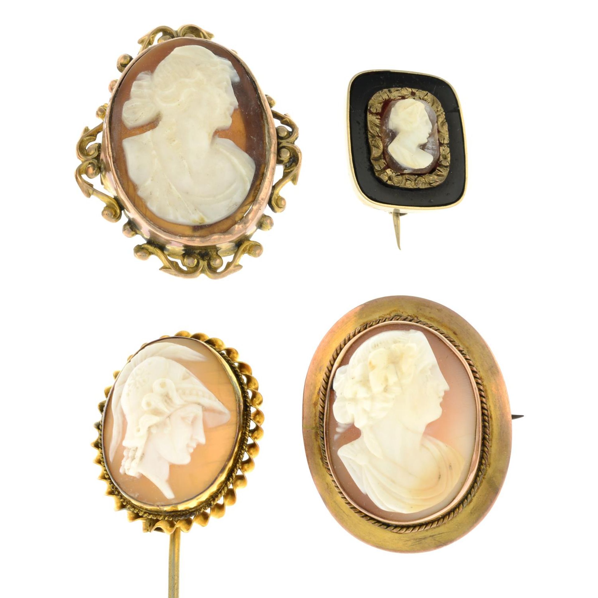 Three shell cameo brooches and a stickpin.