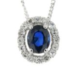 A sapphire and diamond cluster pendant, with 9ct gold chain.Estimated total diamond weight 0.10ct.