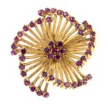 A mid 20th century 18ct gold ruby floral brooch.Diameter 2.8cms.