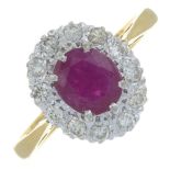 An 18ct gold ruby and diamond cluster ring.Estimated total diamond weight 0.35ct.