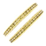 Two 18ct gold 'yellow' diamond full eternity rings.Estimated total 'yellow' diamond weight 0.80ct.