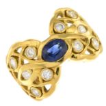 An 18ct gold sapphire and diamond dress ring.Estimated total diamond weight 0.40ct.