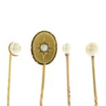 Three cultured pearl stickpins and a split pearl stickpin.