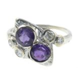 A diamond and amethyst dress ring.Estimated total diamond weight 0.25ct.
