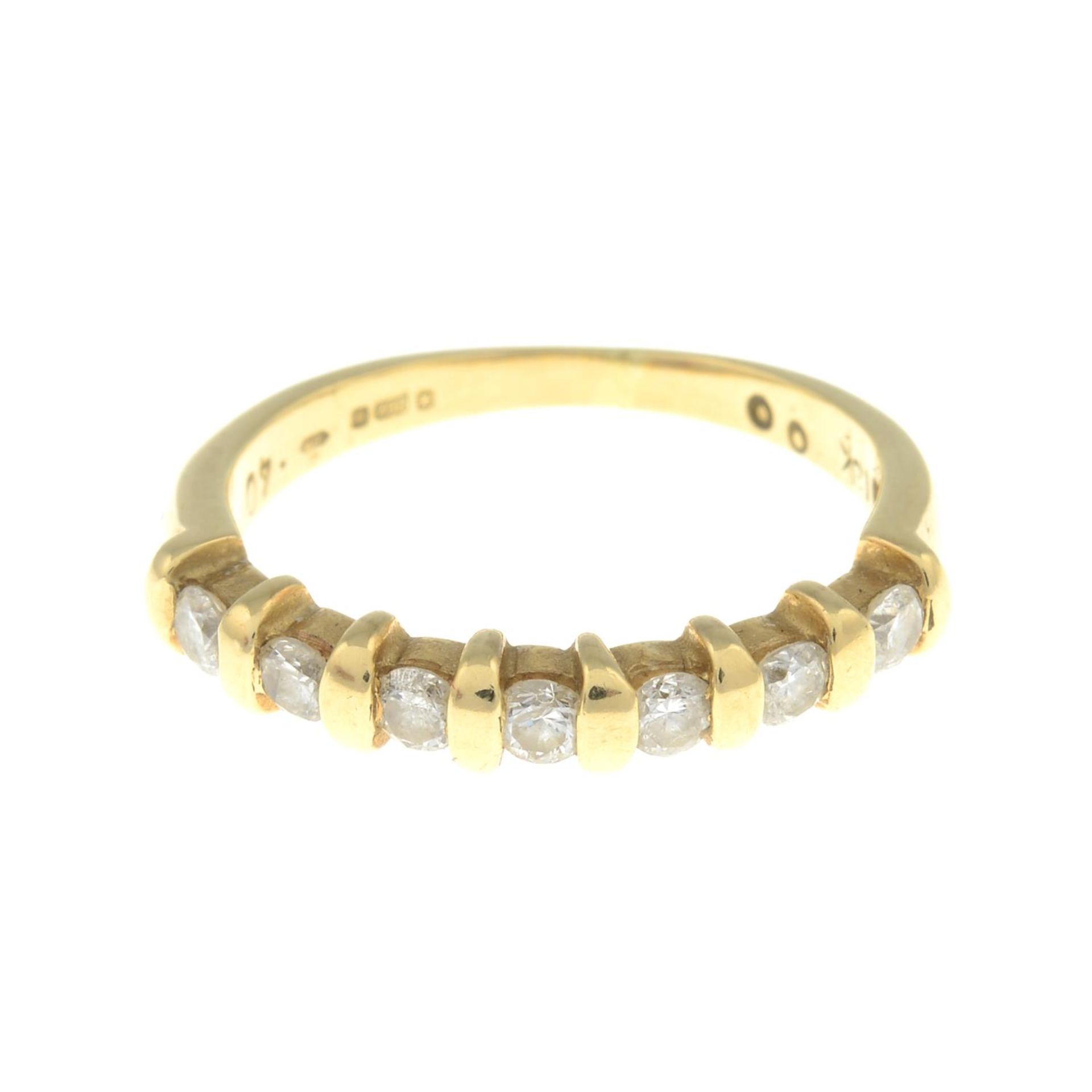 An 18ct gold diamond seven-stone ring.Total diamond weight 0.40ct, stamped to band.