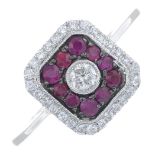 An 18ct gold brilliant-cut diamond and ruby cluster ring.Total diamond weight 0.27ct,