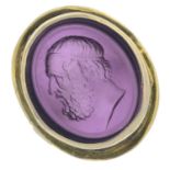 A gentleman's purple paste intaglio signet ring.Band replacement stamped 9ct.Ring size P.