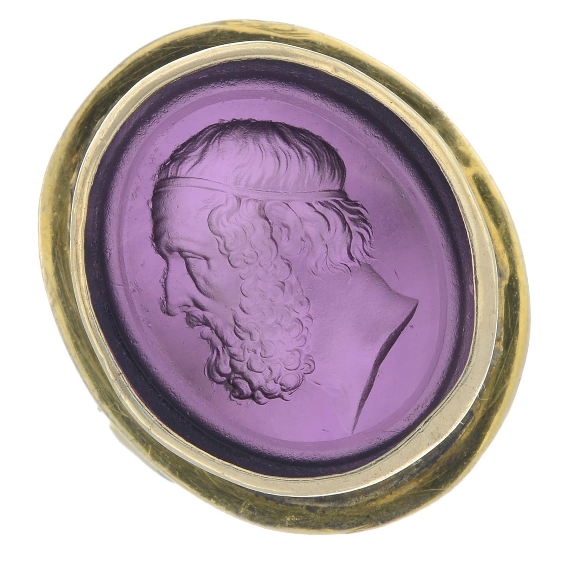 A gentleman's purple paste intaglio signet ring.Band replacement stamped 9ct.Ring size P.