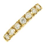 An 18ct gold diamond seven-stone band ring.Estimated total diamond weight 0.50ct.Hallmarks for