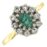An 18ct gold emerald and diamond cluster ring.Estimated total diamond weight 0.25ct.