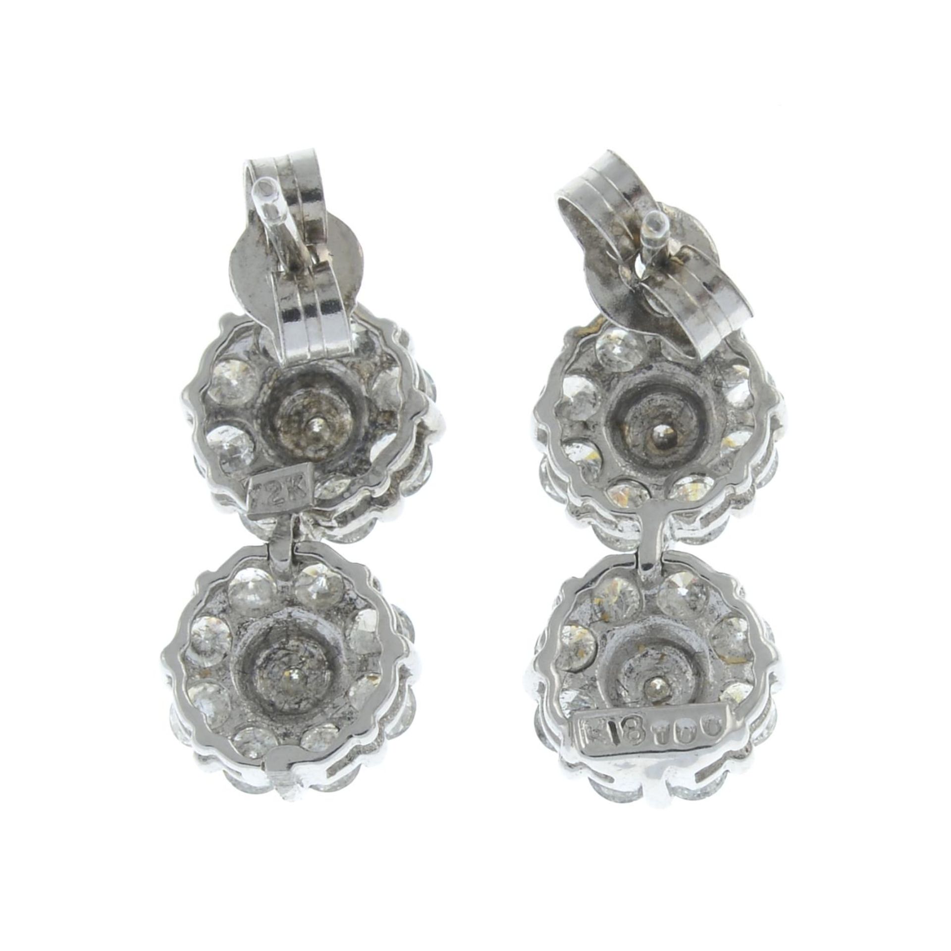 A pair of 18ct gold diamond cluster drop earrings.Total diamond weight 1ct, stamped to mount. - Image 2 of 2