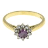 An 18ct gold ruby and diamond cluster ring.Estimated total diamond weight 0.15ct.Hallmarks for