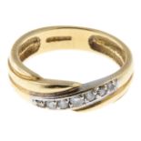 An 18ct gold brilliant-cut diamond band ring.Estimated total diamond weight 0.10ct.