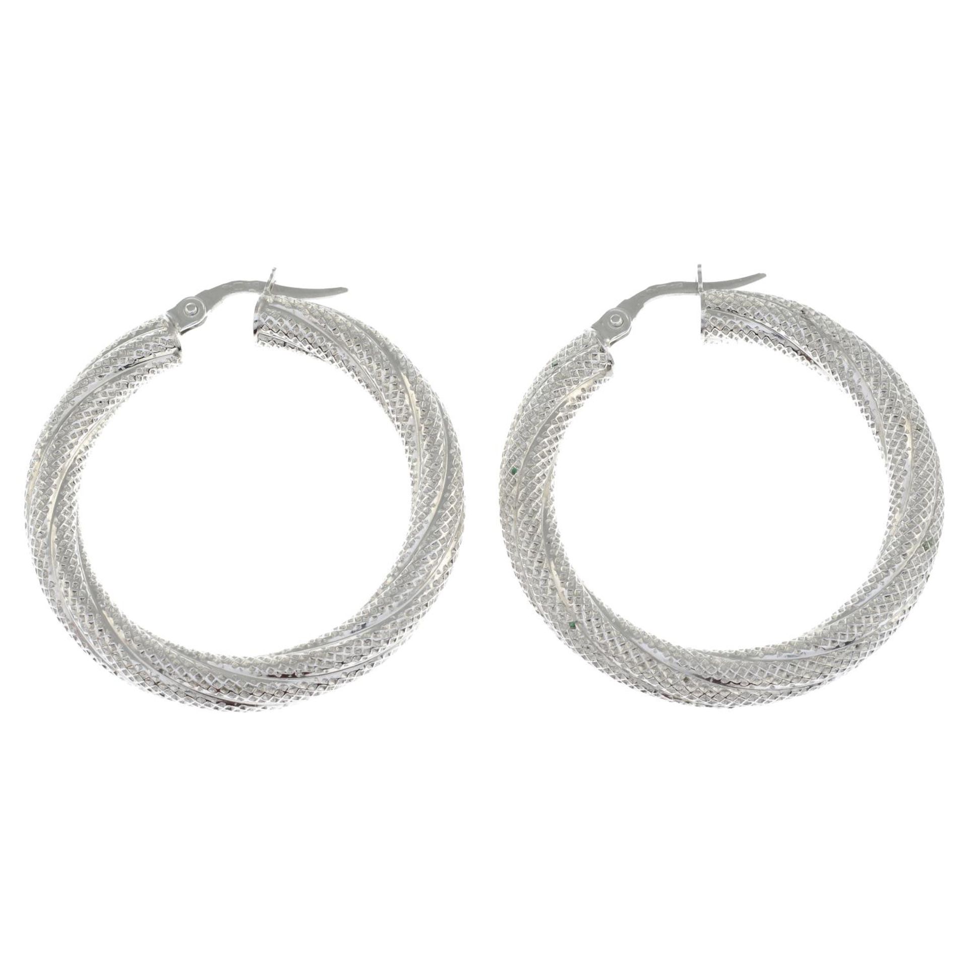 A pair of 9ct gold textured hoop earrings.Hallmarks for 9ct gold.