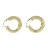 A pair of 9ct gold textured hoop earrings.Import marks for Birmingham.Length 2.8cms.