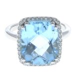 A 14ct gold blue topaz and diamond ring.Estimated total diamond weight 0.15ct.