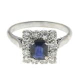 A sapphire and diamond cluster ring.Estimated total diamond weight 0.45ct.