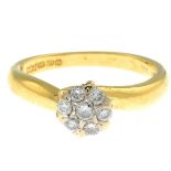 An 18ct gold diamond cluster ring.Estimated total diamond weight 0.25ct.