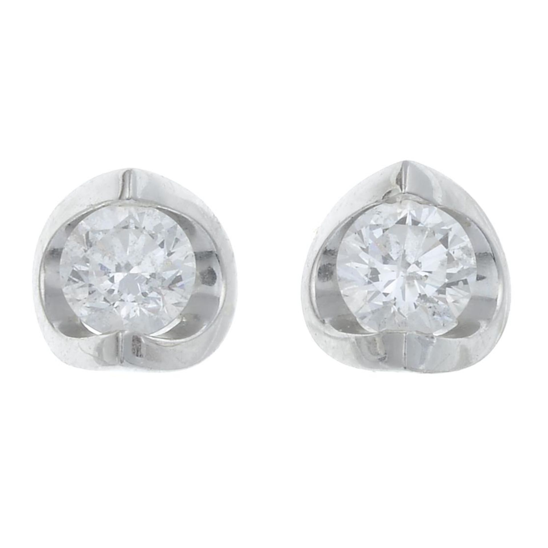 A pair of 18ct gold diamond stud earrings.Estimated total diamond weight 0.45ct,