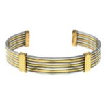 An 'Acier' bi-colour cuff bangle, by Cartier.Signed Acier, Cartier, 734292.