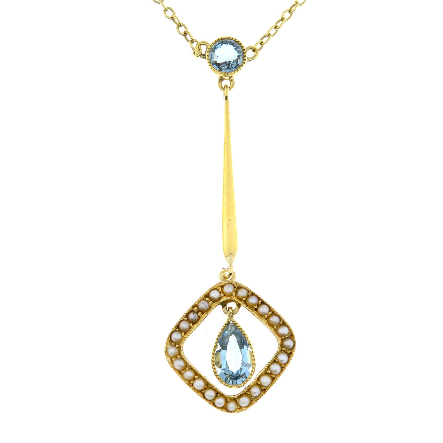 An early 20th century 15ct gold aquamarine and split pearl necklace.