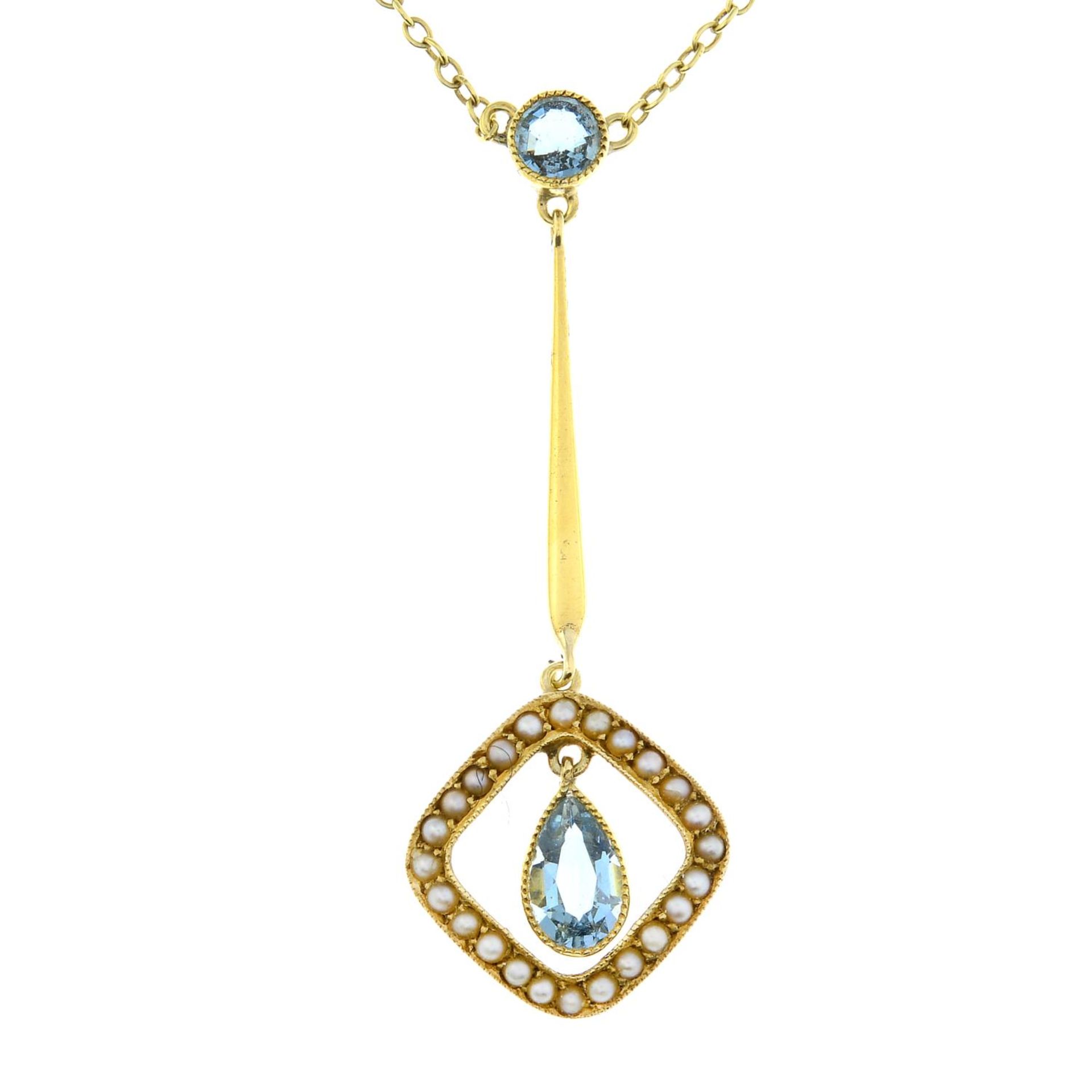 An early 20th century 15ct gold aquamarine and split pearl necklace.