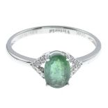 An emerald and diamond dress ring.Emerald weight 0.90ct,