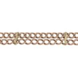 An early 20th century double-row curb-link chain bracelet.Clasp deficient.Stamped 375,
