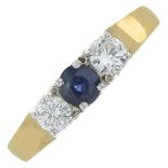 An 18ct gold sapphire and diamond three-stone ring.Estimated total diamond weight 0.30ct,