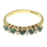 An 18ct gold emerald and diamond band ring.Total diamond weight 0.10ct,