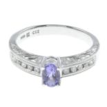 A tanzanite and diamond dress ring, with engraved gallery.