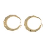 Two pairs of hoop earrings.Stamped 375.