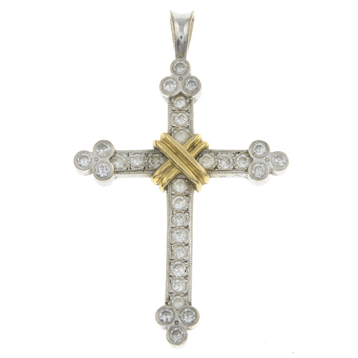 An 18ct gold diamond cross pendant.Estimated total diamond weight 0.75ct.Hallmarks for