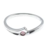 An 18ct gold 'pink' diamond single-stone ring.'Pink' diamond weight 0.08ct, SI clarity.