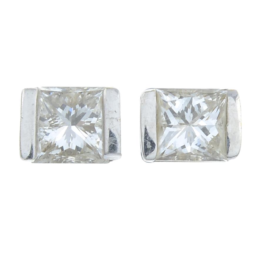 A pair of rectangular-shape diamond stud earrings.Estimated total diamond weight 0.40ct,