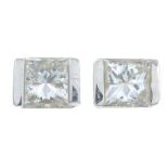 A pair of rectangular-shape diamond stud earrings.Estimated total diamond weight 0.40ct,