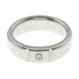 A diamond single-stone band ring.Stamped PD to indicate palladium.