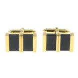 A pair of 18ct gold onyx cufflinks.Hallmarks for London, 2008.Length of cufflink face 2.2cms.