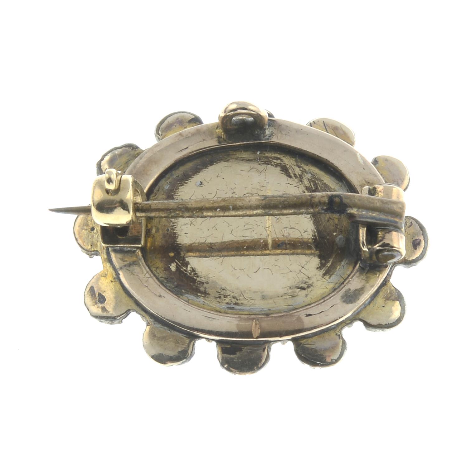 A late 19th century garnet and split pearl brooch.Length 2cms. - Image 2 of 2