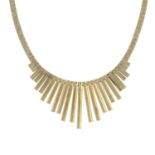 A 9ct gold fringe necklace, on an integral brick-link chain.