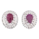 A pair of ruby and diamond cluster clip earrings.Three diamonds deficient.Estimated total diamond