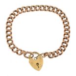 An early 20th century gold curb-link bracelet, with later 9ct gold heart-shape padlock clasp.