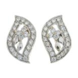 A pair of cubic zirconia floral earrings.