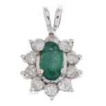 An 18ct gold emerald and diamond cluster pendant.Estimated total diamond weight 0.30ct.Hallmarks