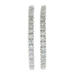 A pair of 9ct gold brilliant-cut diamond hoop earrings.Estimated total diamond weight