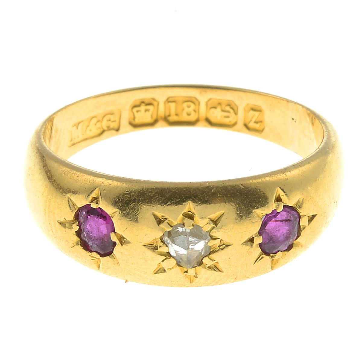 A late Victorian 18ct gold ruby and diamond three-stone ring.Hallmarks for Birmingham, 1899.