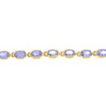 An 18ct gold tanzanite line bracelet.Hallmarks for 18ct gold.